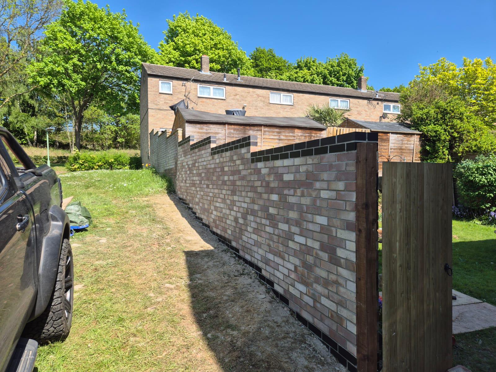 Brick boundary wall construction in Suffolk