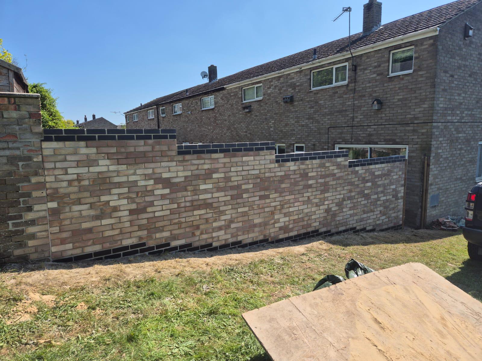 New brick boundary wall build in Suffolk