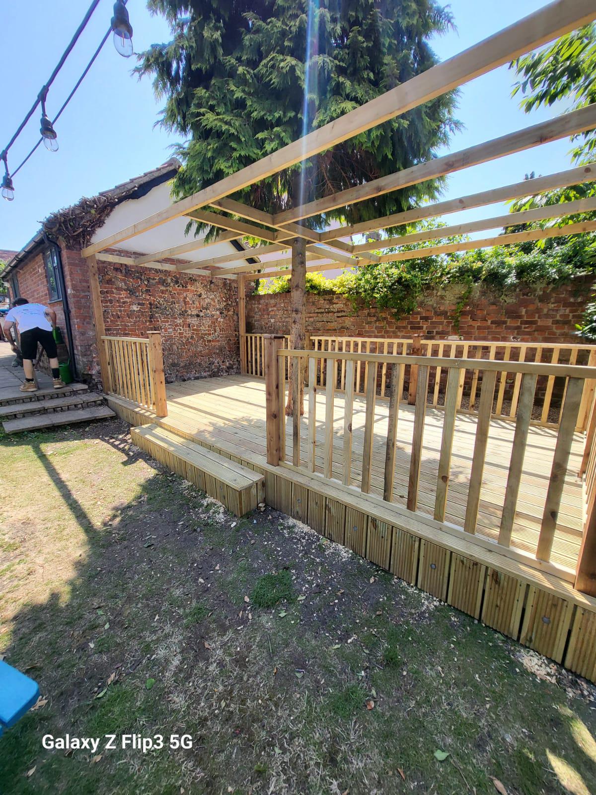 Raised timber deck with pergola in Suffolk