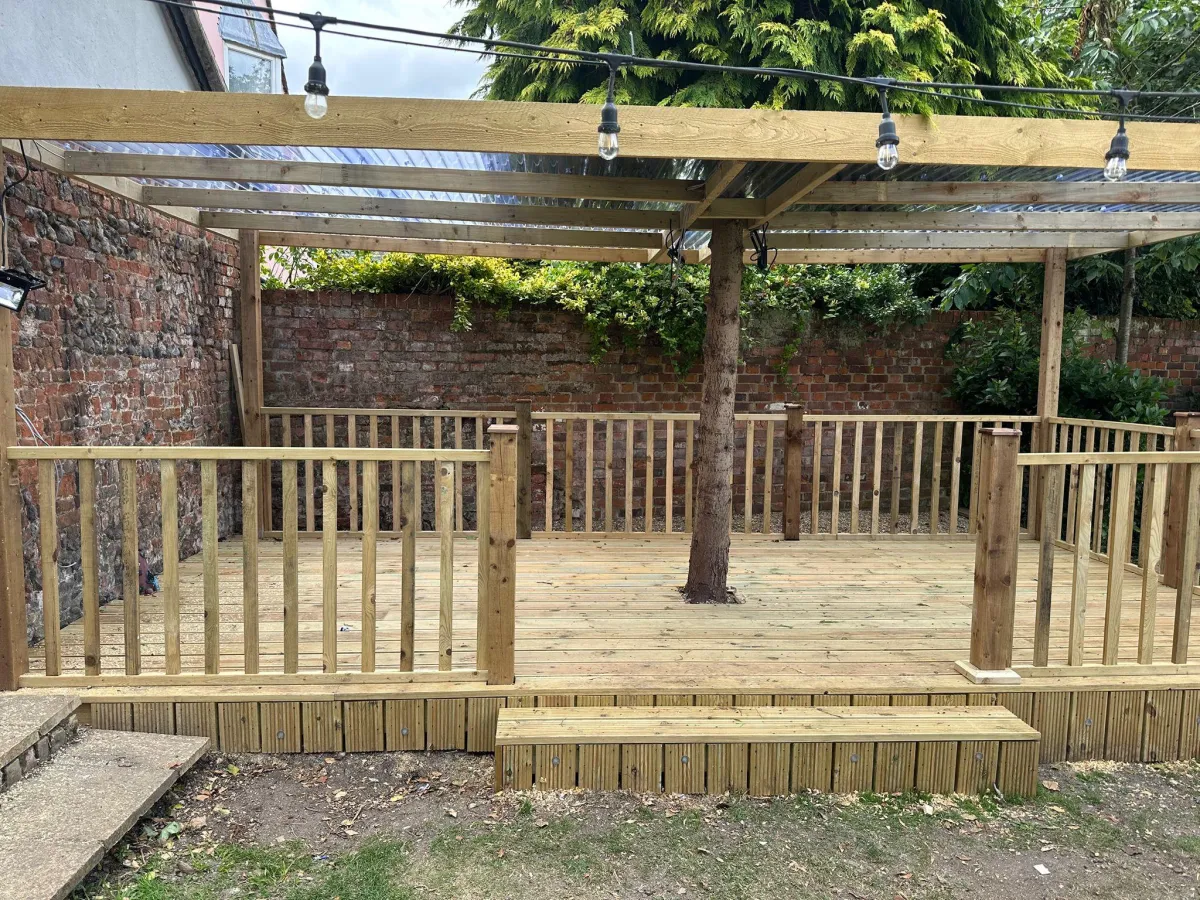 Hardwood deck installed by David Price Building Services in a Suffolk garden